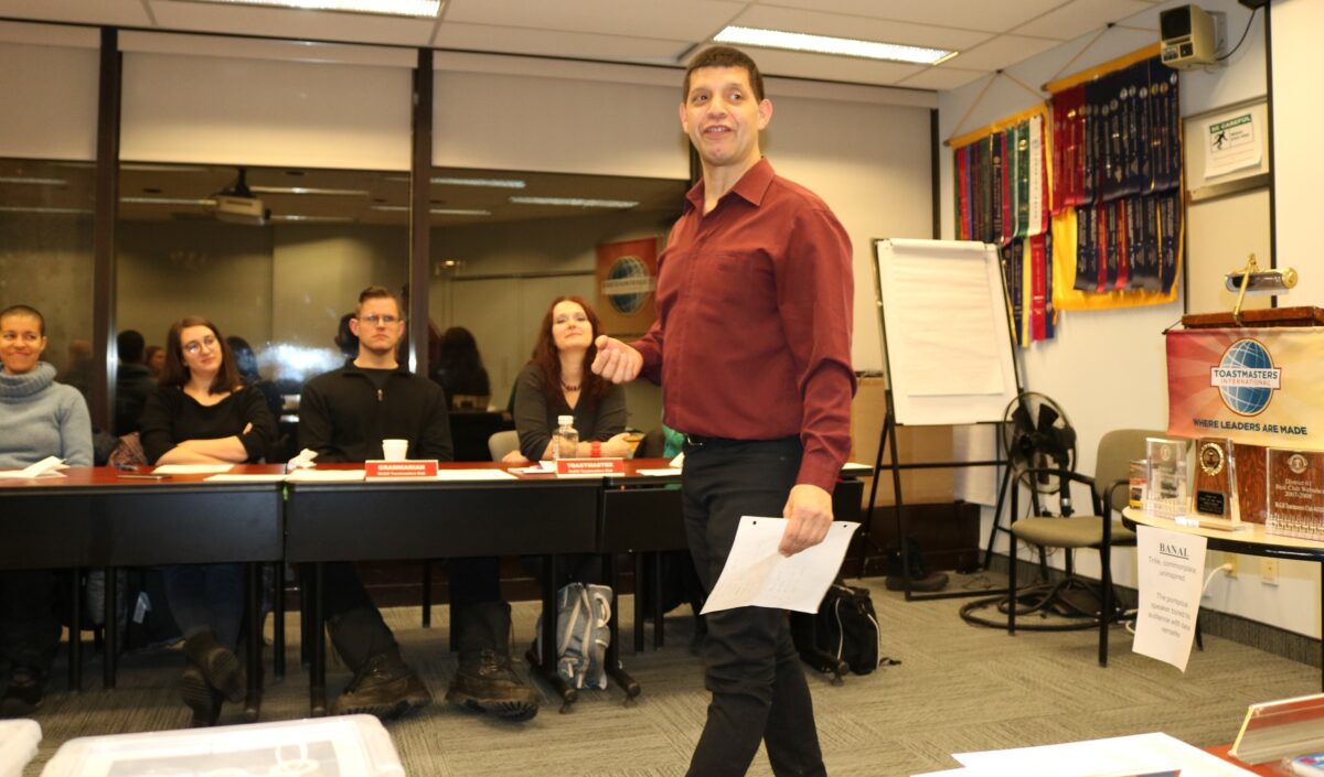 Alain Guillot at a Toastmaster meeting improving his public speaking skills