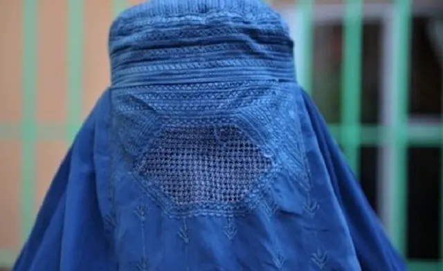 Women covering her face with a burka
