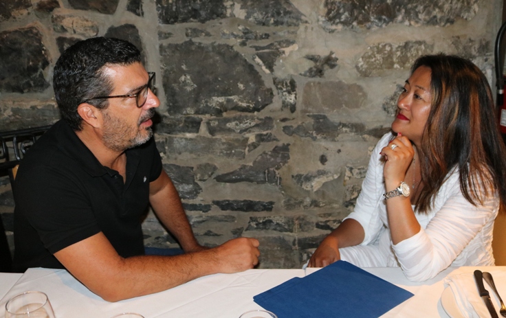 Lin Sok, financial advisor, talking to a client