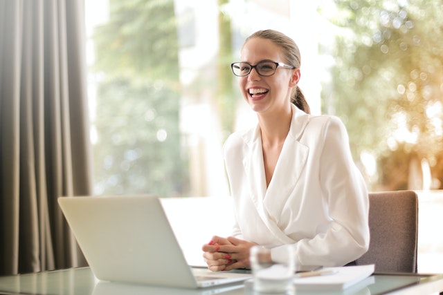 Woman holding a sheet of paper in an office