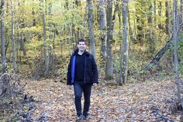 Alain Guillot walking in the woods