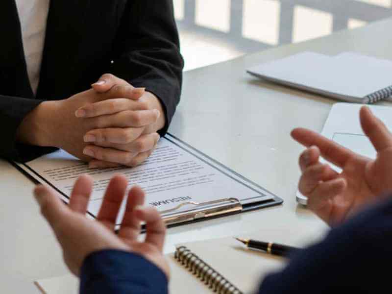 man explaining talking to woman in the workspace