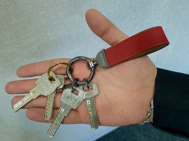 Hand holding several keys