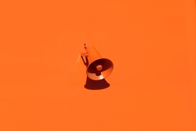 Loud speaker on orange background