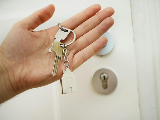 Man holding the keys to a home